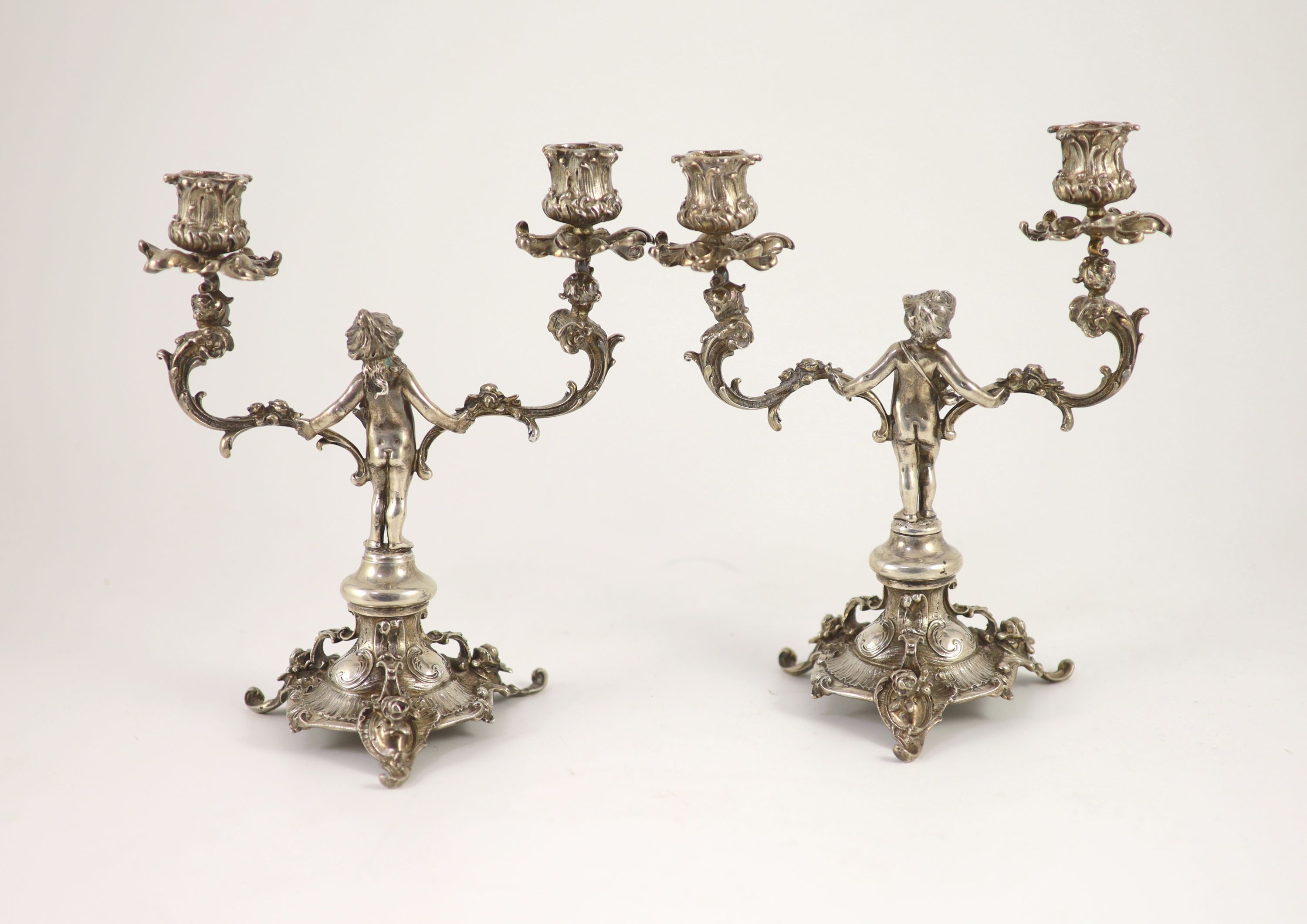 A pair of late Victorian silver two light, two branch candelabra